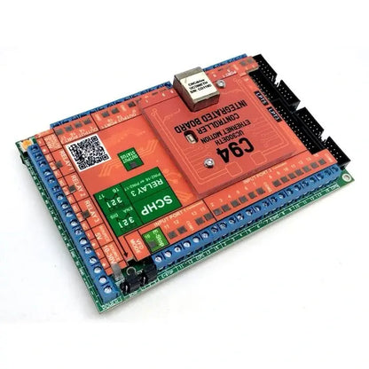 Angled view of the UC300ETH + C94 bundle showing optoisolated input terminals, relays and IDC26 expansion headers