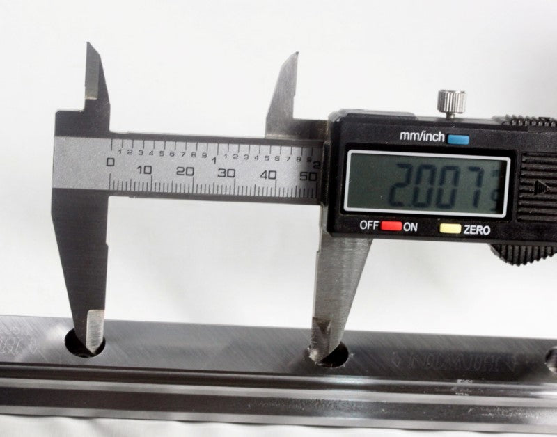 Measurement showing 2 inches of spacing between holes. 