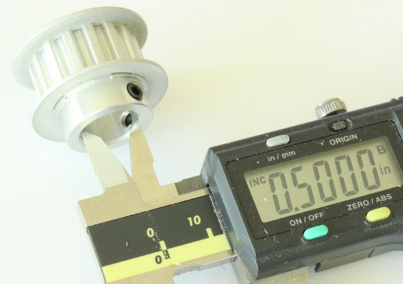 XL 15 teeth drive pulley 1/2" bore .2" pitch shown with caliper on the bore diameter. The measurement reads .5 inches. 