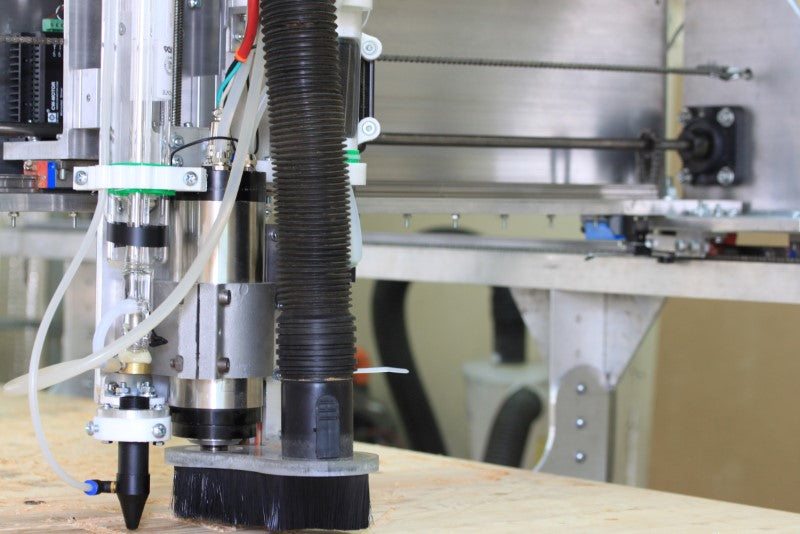 Fabricator Pro CNC Router machine view of the left side of the z axis assembly and the CO2 laser nozzle, spindle and dust shoe