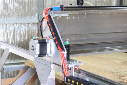 Fabricator Pro CNC Machine view of the left gantry stepper motor side with the cable carrier and cable management