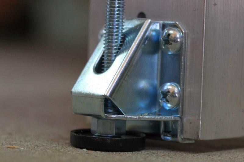 Fabricator Pro CNC Router view of the bottom of each leveling foot or leg of the table on the machine.  Leveling feet are attached to each leg.