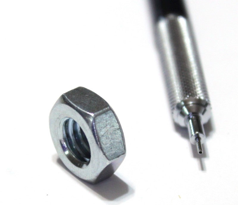 3/8 inch machine nut shown with mechanical pencil for scale 