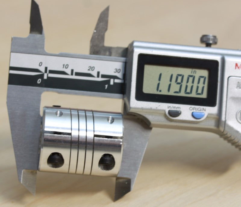 Caliper measurement of the length at 1.19 inches of the 1/4" to 1/2" (12.7mm to 6.35mm) one piece flexible clamping coupling