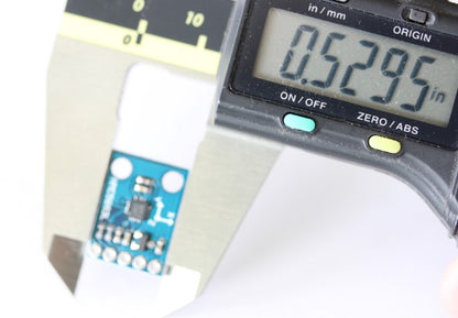 Triple Axis Magnetometer shown with caliper. The measurement reads .5295 inches (13.44 mm). 