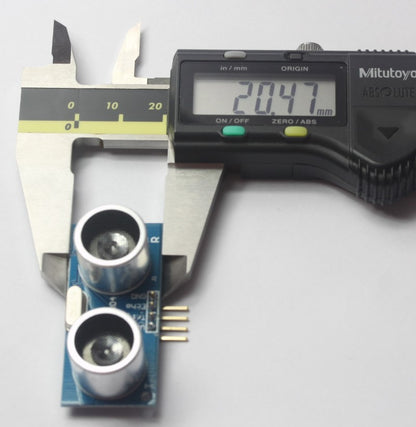 Picture shows the width of an Ultrasonic Range Finder Distance Measurement Sensor, measuring 20.47 mm. 