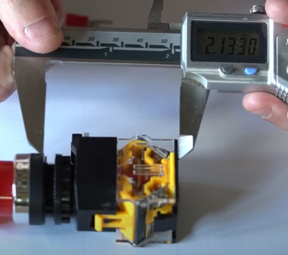 Distance the modular e-stop will protrude inside the control box.