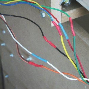 Close up of soldered wires and insulated with heat shrink